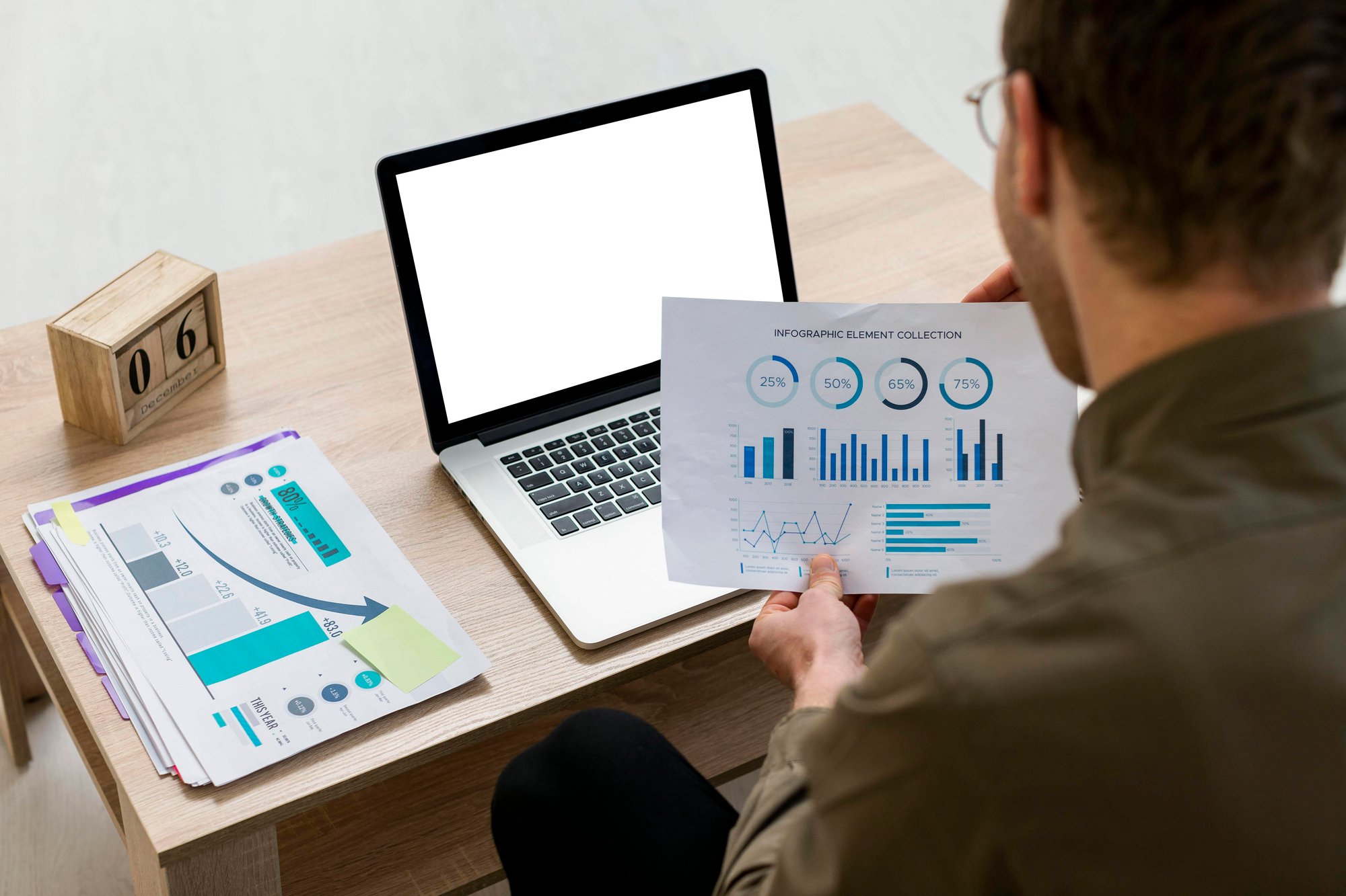 man-working-with-infographics-indoors man-working-with-infographics-indoors